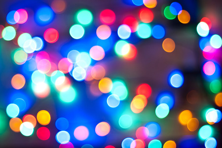 Color Bokeh against a dark background for use at graphic design