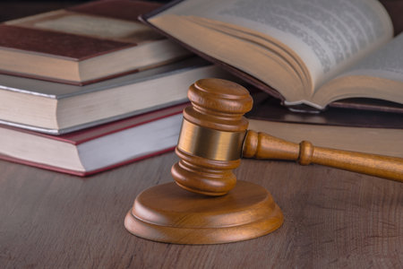 judge's gavel on a wooden worktop.の写真素材