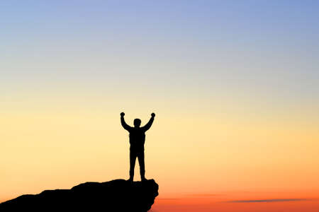 Determined, pursuing his goal, a man reaches the top alone. Luckyの写真素材