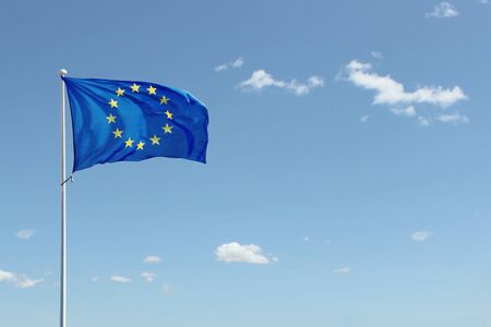 European Union flag in blue sky background. Copy spaceの写真素材