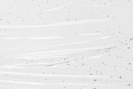 Serum texture, clear liquid gel with bubbles. Transparent cosmetic skin care product sample. Hand sanitizer, alcohol gel backgroundの写真素材