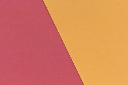 Color paper background. Two tone red and orange tone paper sheets overlap