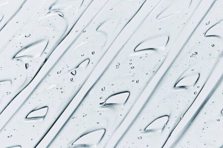 Liquid gel texture. Skin care product smudge abstract background. Clear collagen gel, moisturiser smear patternの写真素材