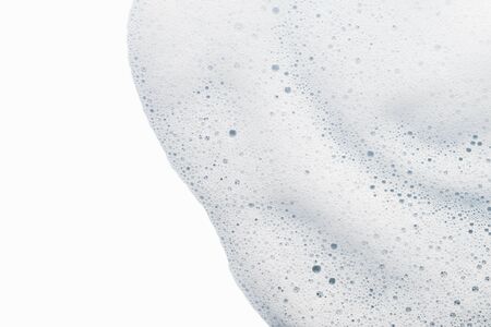 Cleanser foam texture isolated on white background. Soap, shower gel, shaving creamy foam bubbles. Foamy skin care productの写真素材
