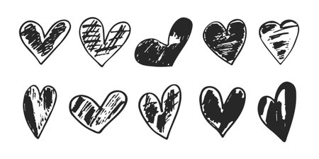 A set of black hand-drawn grunge hearts on a white background for Valentine's Day or to express love and romantic concepts. Vector.のイラスト素材