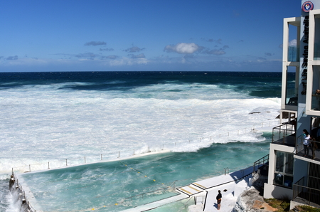 Sydney, Australia - Oct 23, 2016 Bondi Iceberg's swimming pools with ocean view at high tide. Big tide at the beach Bondi Icebergs Club waves fill the pool.のeditorial素材