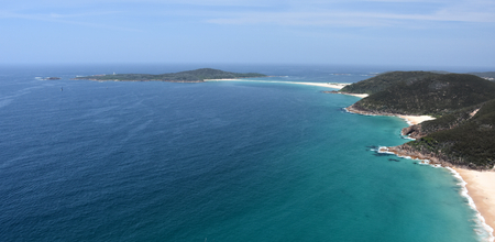Shark Island and coastline of Shoal bay on a sunny day from Mount Tomaree Lookout (Central Coast, NSW, Australia)の写真素材