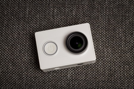 White Mini Action Camera.  Top Close View