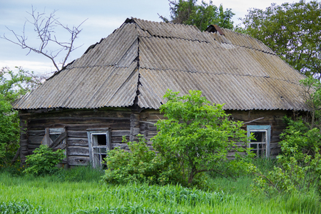 Old Wooden gloomy Cabin in the villageの写真素材