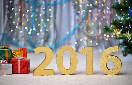 Christmas celebration card with golden numbers, balls and decorationsの写真素材