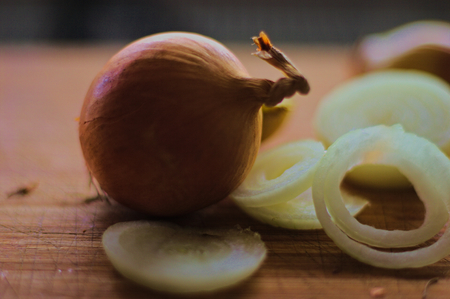 Onion on a wooden boardの写真素材