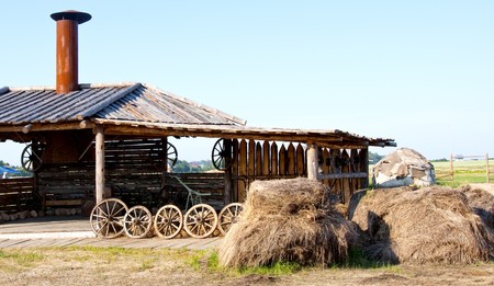Smithy and haystacks in villageの写真素材