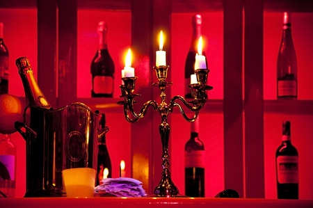 Five candels with flame in candelstick in barの写真素材