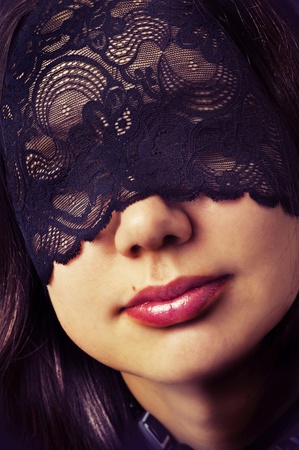 Sexy female full lips with red lipstick closeup and lase mask over eyesの写真素材