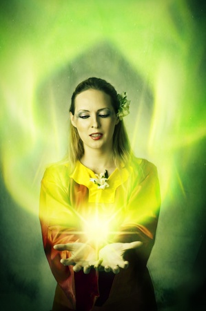 Young woman elf or witch making magic. Fantasy portraitの写真素材