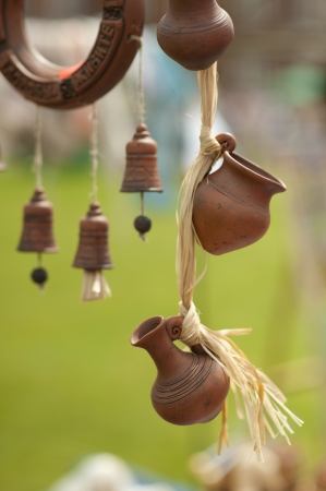 Souvenirs for tourists - miniature clay pot and a jug hanging from a ropeのeditorial素材