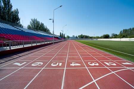 Red treadmill at the stadium with the numbering from one to sevenのeditorial素材