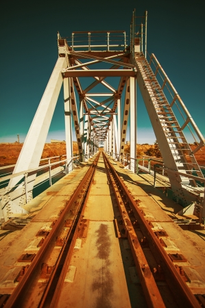 railway bridge through small river . Retro style of pictureの写真素材
