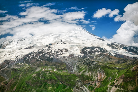 Mount Elbrus in clouds. View from top of Cheget mountain