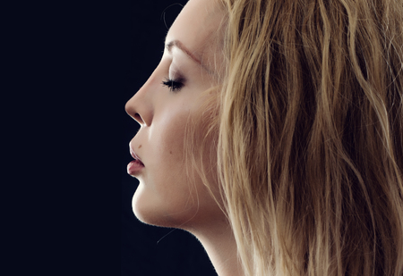 Beautiful face of perfect young woman in profileの写真素材