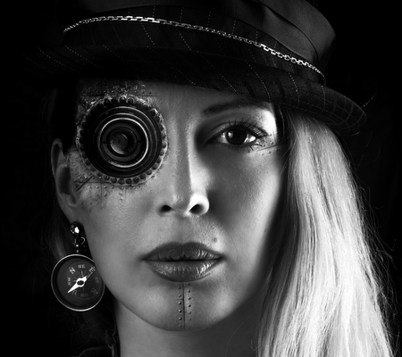 Steampunk girl portrait on black. Monocular lens on eye implant
