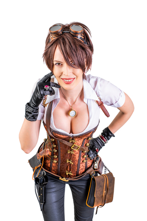 Portrait of a beautiful steampunk woman wearing vintage corset and retro gogglesの写真素材