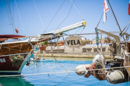 KYRENIA, CYPRUS - AUGUST 09, 2018: turkish republic of northern cyprus. Fishing ships are on the port of Kyrenia near the castleのeditorial素材