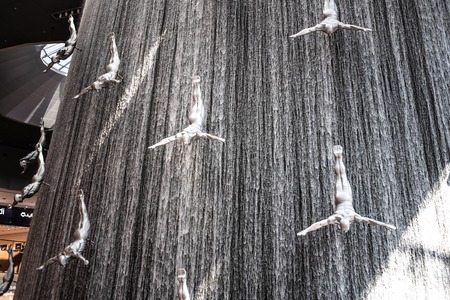 DUBAI, UNITED ARAB EMIRATES - MARCH 12, 2019: Waterfall and sculptural composition of pearl divers...