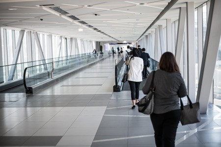 DUBAI, UNITED ARAB EMIRATES - MARCH 12, 2019: people go in the morning to work on corridor of subway station in the direction of Dubai Mallのeditorial素材