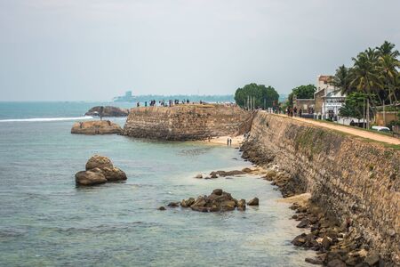 GALLE, SRI LANKA - MARCH 16, 2019: Rocks or large stones in the Indian Ocean near Galle Fort in Sri Lankaのeditorial素材