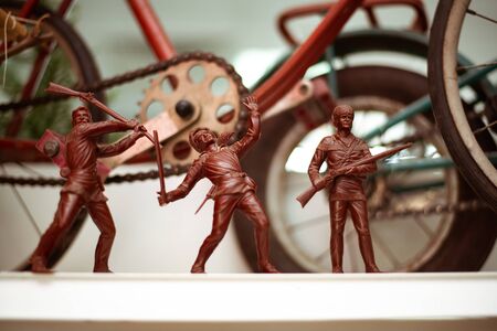 SOCHI, RUSSIA - SEPTEMPER 08, 2017: Old Soviet children's toys three red soldiers with weapons. Exposition at the Museum of the USSR in Sochi, Russiaのeditorial素材