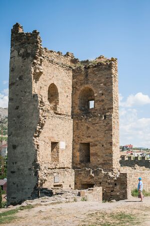 SUDAK, RUSSIA - JULY, 22, 2016 Tourists and Walls and towers of an ancient Genoese fortress in the city of Sudak, Crimea, Russiaのeditorial素材