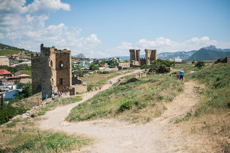 SUDAK, RUSSIA - JULY, 22, 2016 Tourists and Walls and towers of an ancient Genoese fortress in the city of Sudak, Crimea, Russiaのeditorial素材