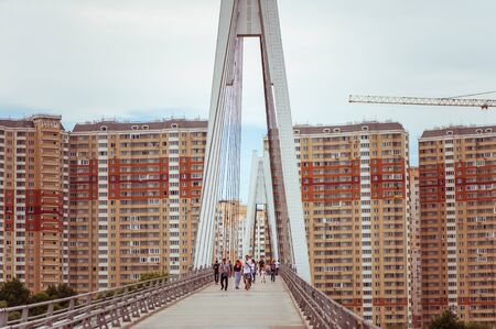 SUDAK, RUSSIA - JUNE, 25, 2015: People strolling along the Pashinsky bridge go from Krasnogorsk to Moscow across the Moscow River, Russiaのeditorial素材