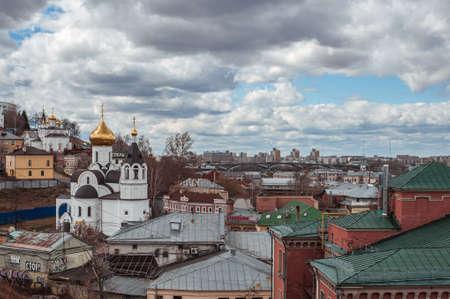 NIZHNY NOVGOROD, RUSSIA - APRIL, 23, 2017: View on Volga river Bed and Breakfast N.A. Bugrov and Church in honor of the icon of the Kazan Mother of God in Nizhny Novgorodのeditorial素材