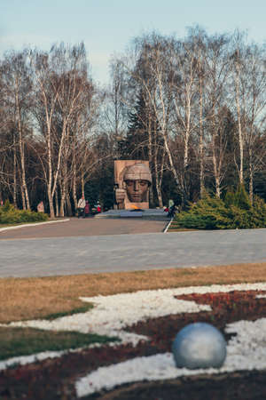 KOLOMNA, RUSSIA - MARCH, 12, 2020: War memorial in memory of the Second World War and the Great Patriotic War of 1941-1945. Sculpture Head of a soldier made of granite stone and Eternal flame of Kolomna, Russiaのeditorial素材