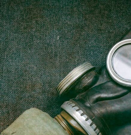 Close up of Protective gas mask with a filter on a gray dirty background, doomsday, virusの写真素材
