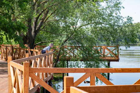 KOLOMNA, RUSSIA - MAY, 30, 2020: Wooden embankment at Moscow River in Kolomna, Russiaのeditorial素材