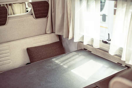 Trailer or car house on wheels in an mobile home. Interior inside table and armchairsの写真素材