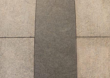 Close up of gray brick marble stones on the ground for street road. Sidewalk, driveway, pavers, pavement in vintage design flooring square pattern texture background.の写真素材