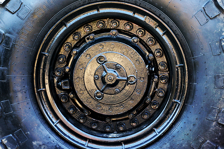 Close up of military vehicle wheel. Large off road tire abstract background. の写真素材