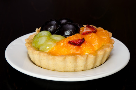 delicious mandarin, strawberry and grape cake imageの写真素材