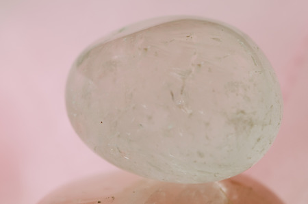 white gemstone on pink backgroundの写真素材