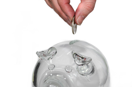 hand with coin and piggy money boyの写真素材