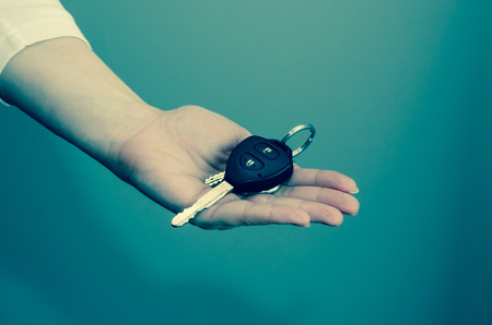 hand with keys on white backgroundの写真素材