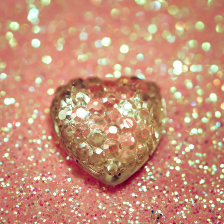 pink heart on shiny background imageの写真素材