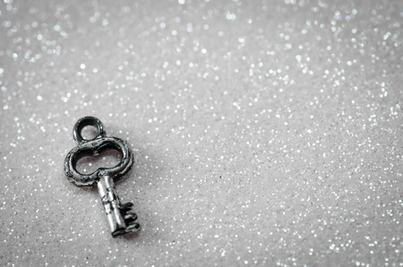 silver key over shiny backgroundの写真素材