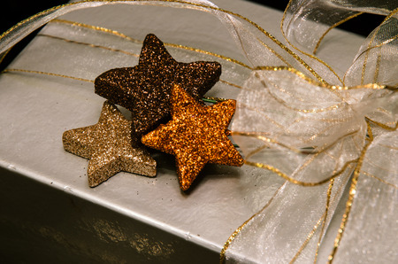 christmas silver gift box with stars and ribbon