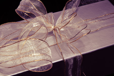 christmas silver gift box with shiny ribbonの写真素材