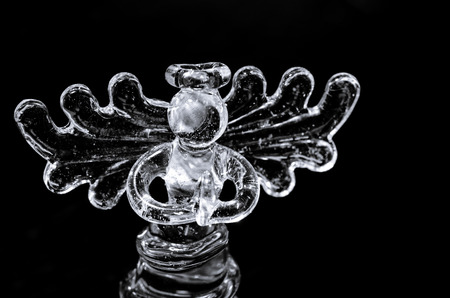 beautiful vitreous angel figure image over black backgroundの写真素材